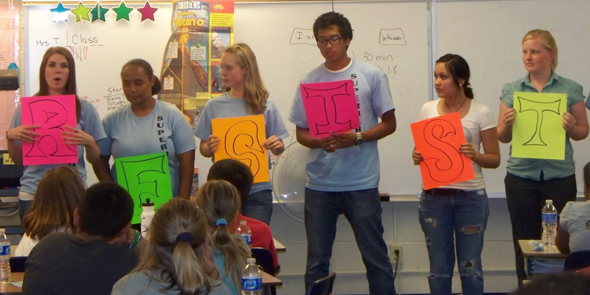 high school students holding RESIST letters